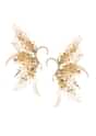 Gold And Beige Handcrafted Earcuff In Mix Metal
