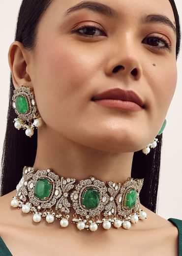 Gold Finish Necklace Set With Emerald Stone In Mix Metal