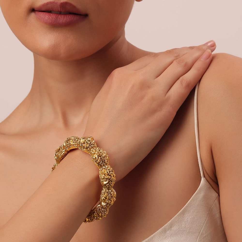 Gold Finish Temple Style Bangle With Carvings