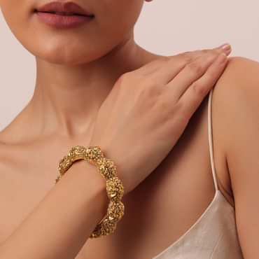 Gold Finish Temple Style Bangle With Carvings