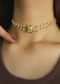 Gold Necklace In A Floral Design Encrusted With Kundan And Two Pearl Strings