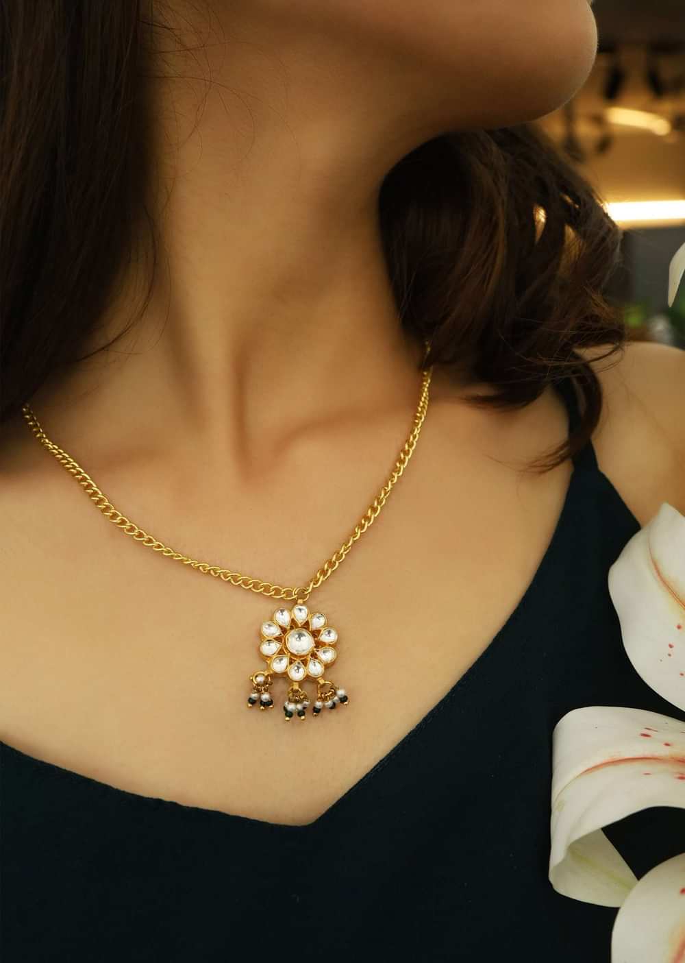 Gold Necklace With Floral Kundan Pendant Accented With Shell Pearls And Green Stones