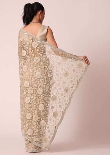 Gold Net Saree With Stone Studded And Florar work And Unstitched Blouse Piece