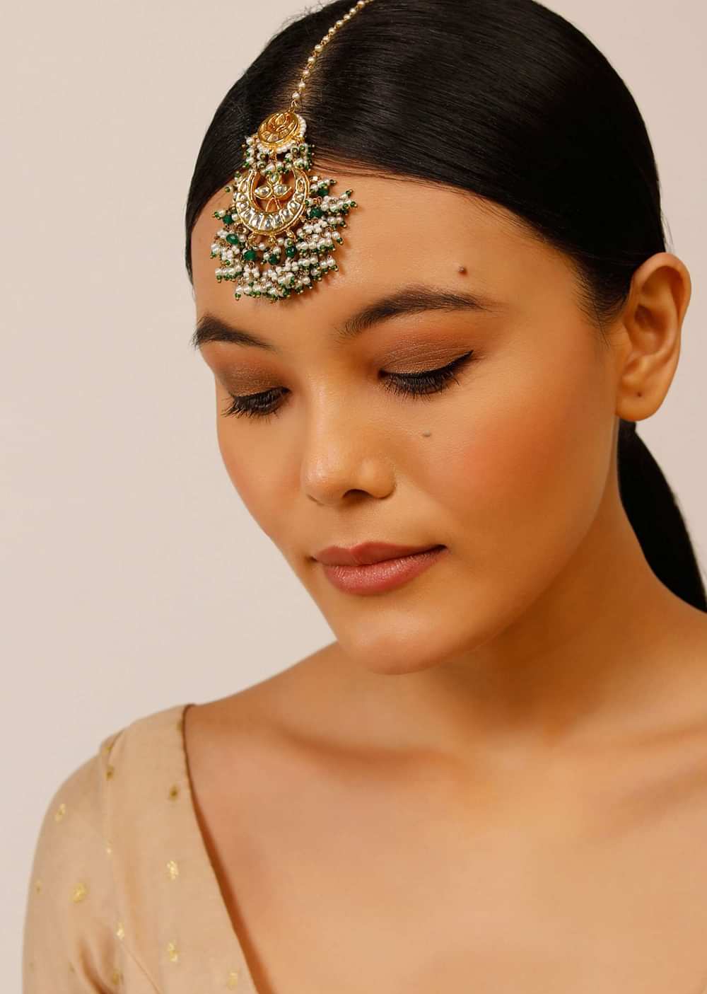 Gold Plated Mangtika With Crescent Polki, Bunches Of Green Beads And Pearls