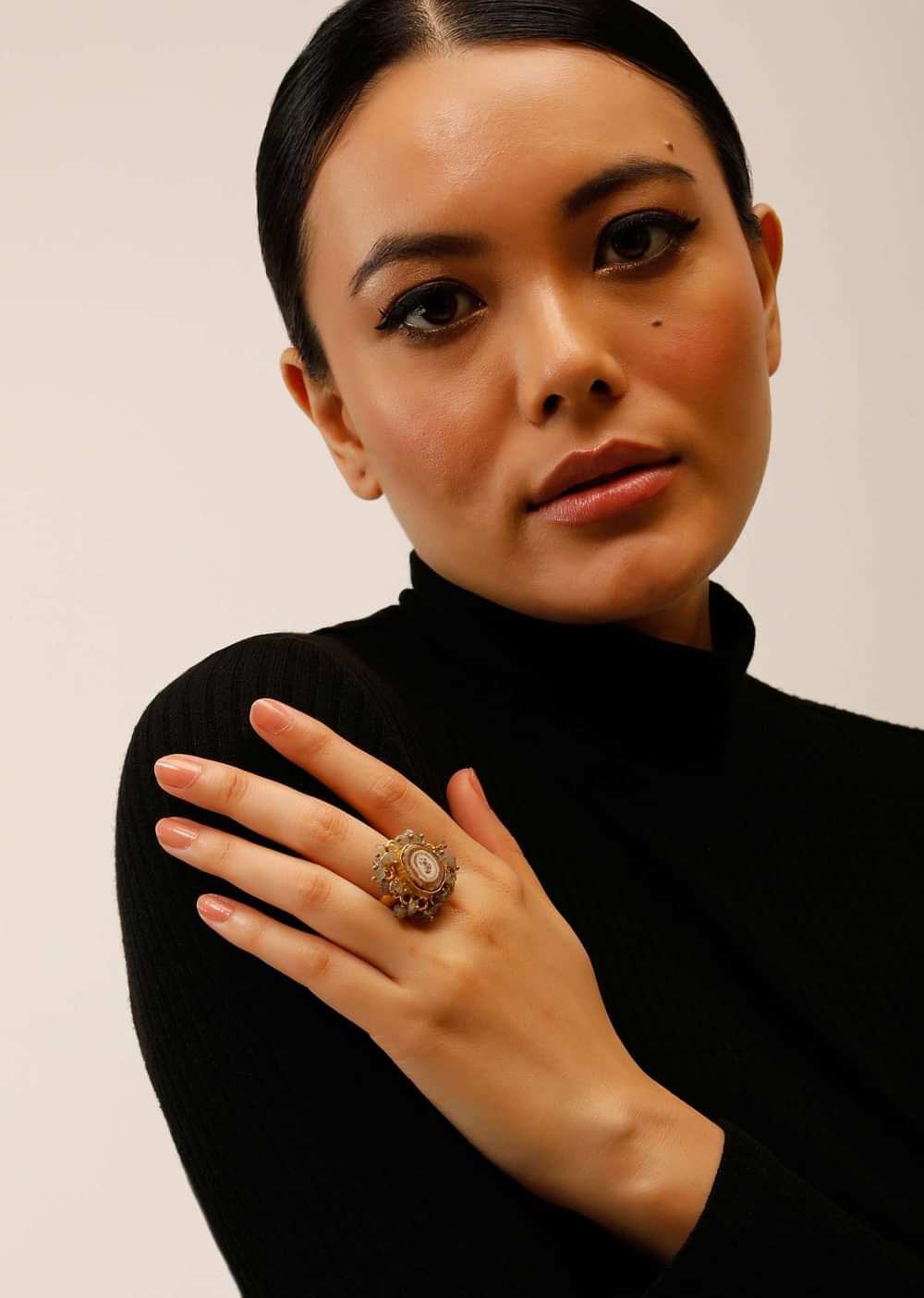 Gold Plated Ring With A Taupe Semi Precious Stone Centre And Tiny Iridescent Stone Pieces All Over
