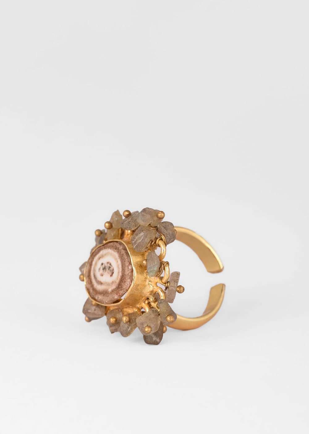 Gold Plated Ring With A Taupe Semi Precious Stone Centre And Tiny Iridescent Stone Pieces All Over