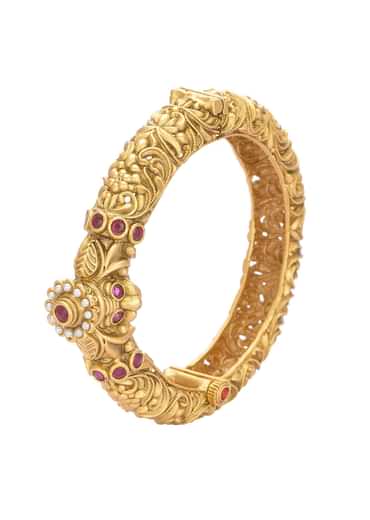 Gold Plated Temple Bangle With Carved Detail And Red Stones