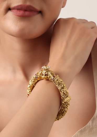 Gold Plated Temple Bangle With Carved Detail And Red Stones