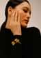 Gold Plated Wrap-Around Bangle With Oval Shaped Yellow Colored Semi Precious Stones