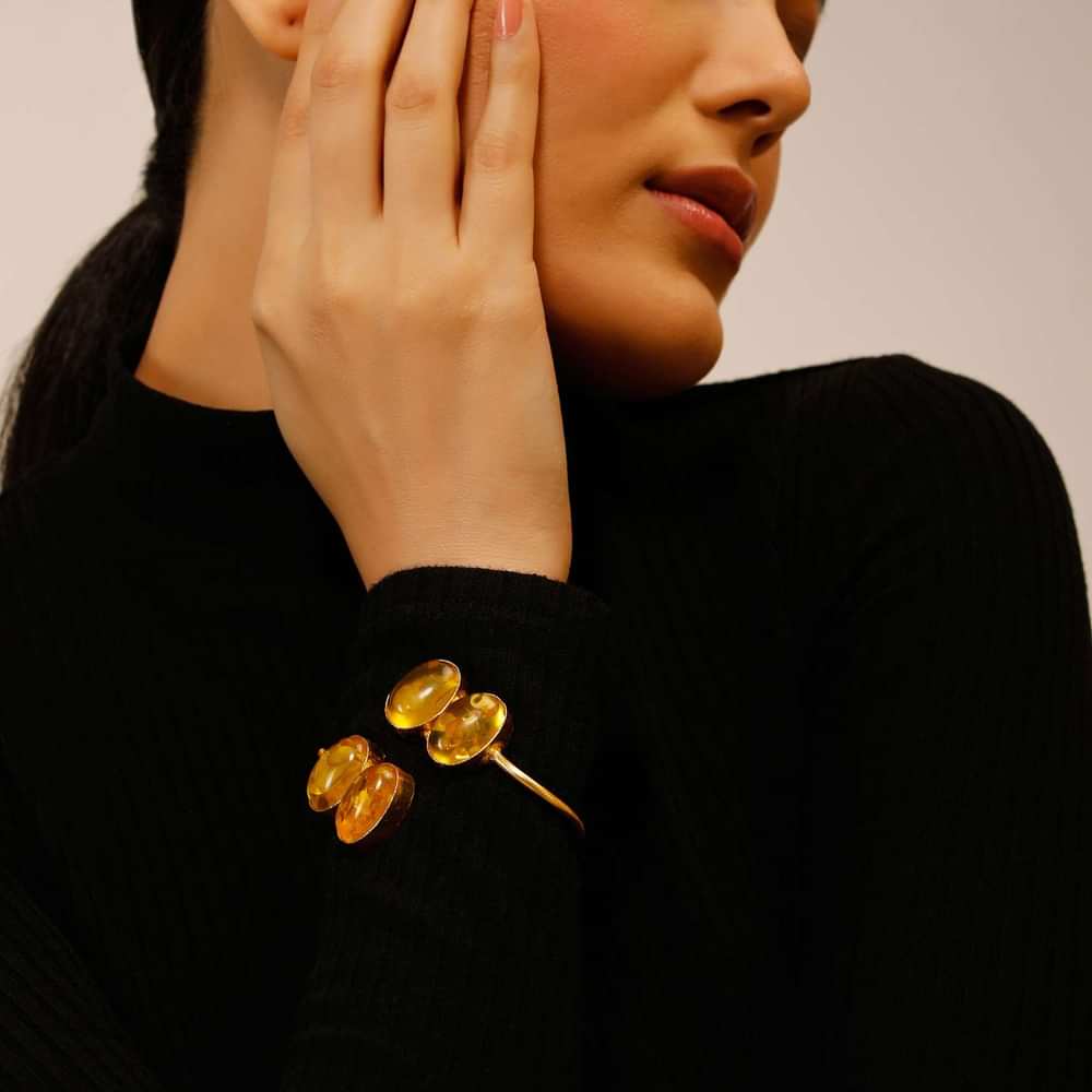 Gold Plated Wrap-Around Bangle With Oval Shaped Yellow Colored Semi Precious Stones