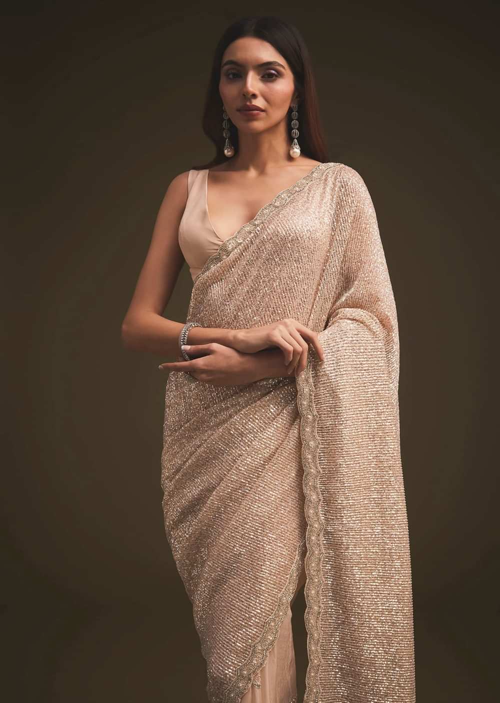 Gold Sequins Saree With An Embellished Border