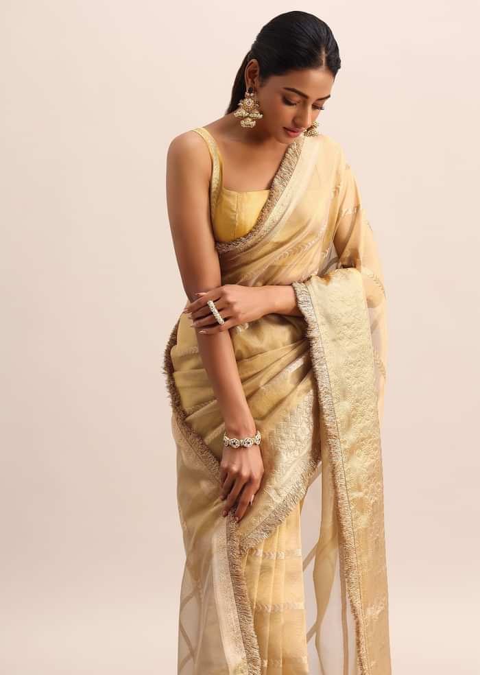 Gold Silk Saree With Zari Woven Border And Zari Frill With Unstitched Blouse