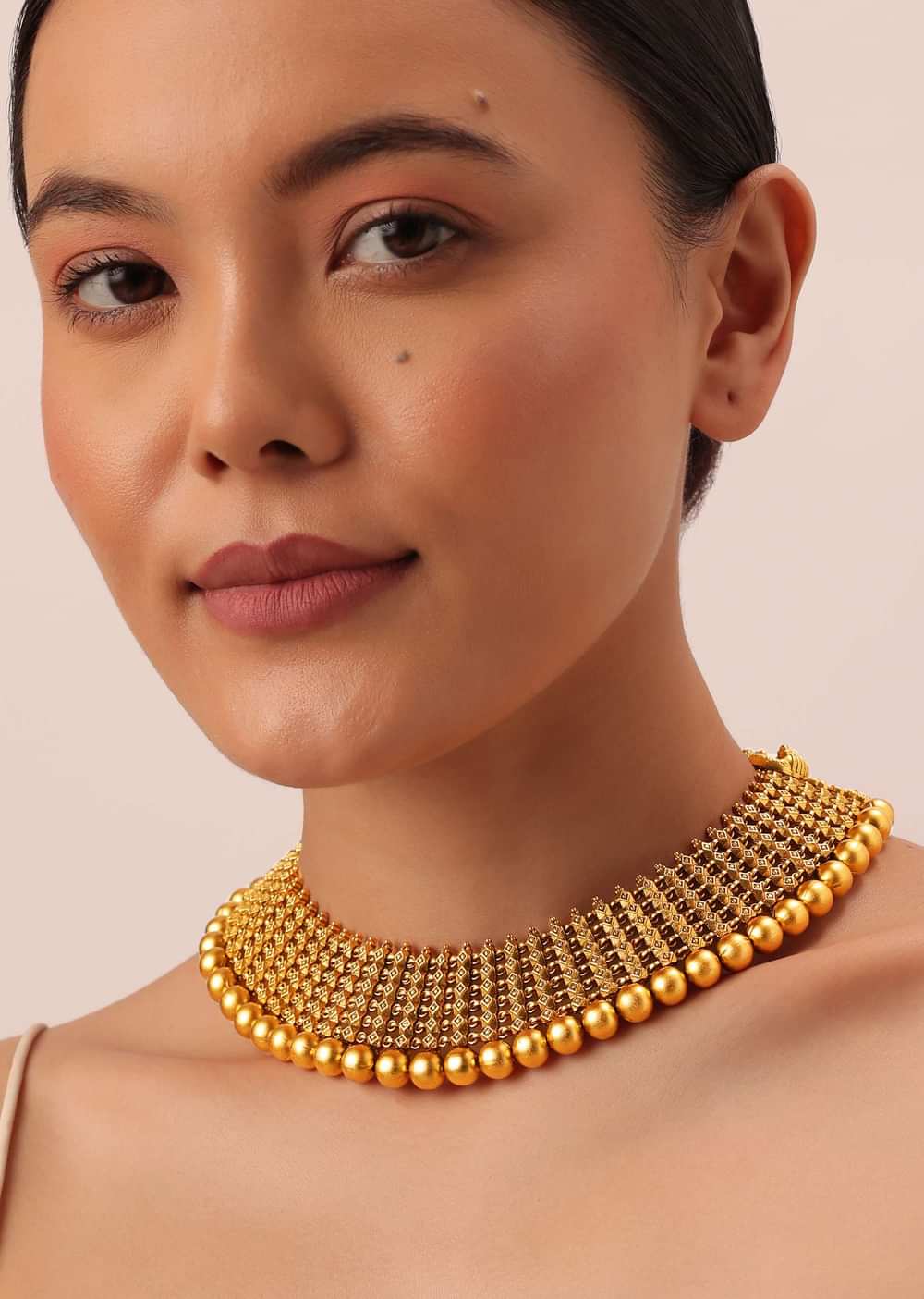 Gold Tone Temple Necklace With Layered Earrings