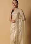 Gold Toned Foil Saree Fabricated In Tissue With Cut Dana Embellished Borders