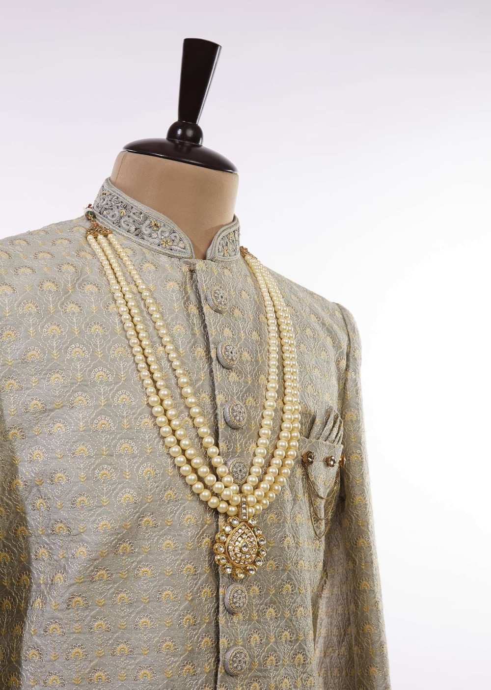 Gold Toned Multi Layered Pearl Mala With Kundan Centre Piece