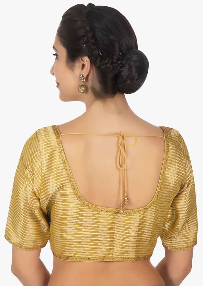 Golden brocaded blouse with golden lace border only on Kalki