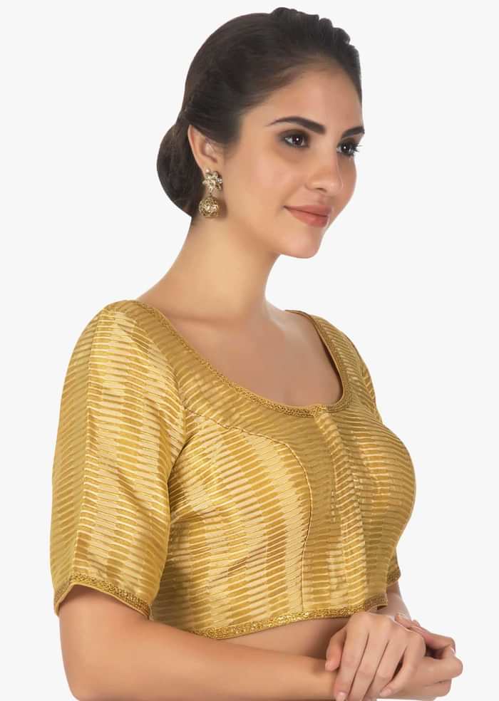 Golden brocaded blouse with golden lace border only on Kalki