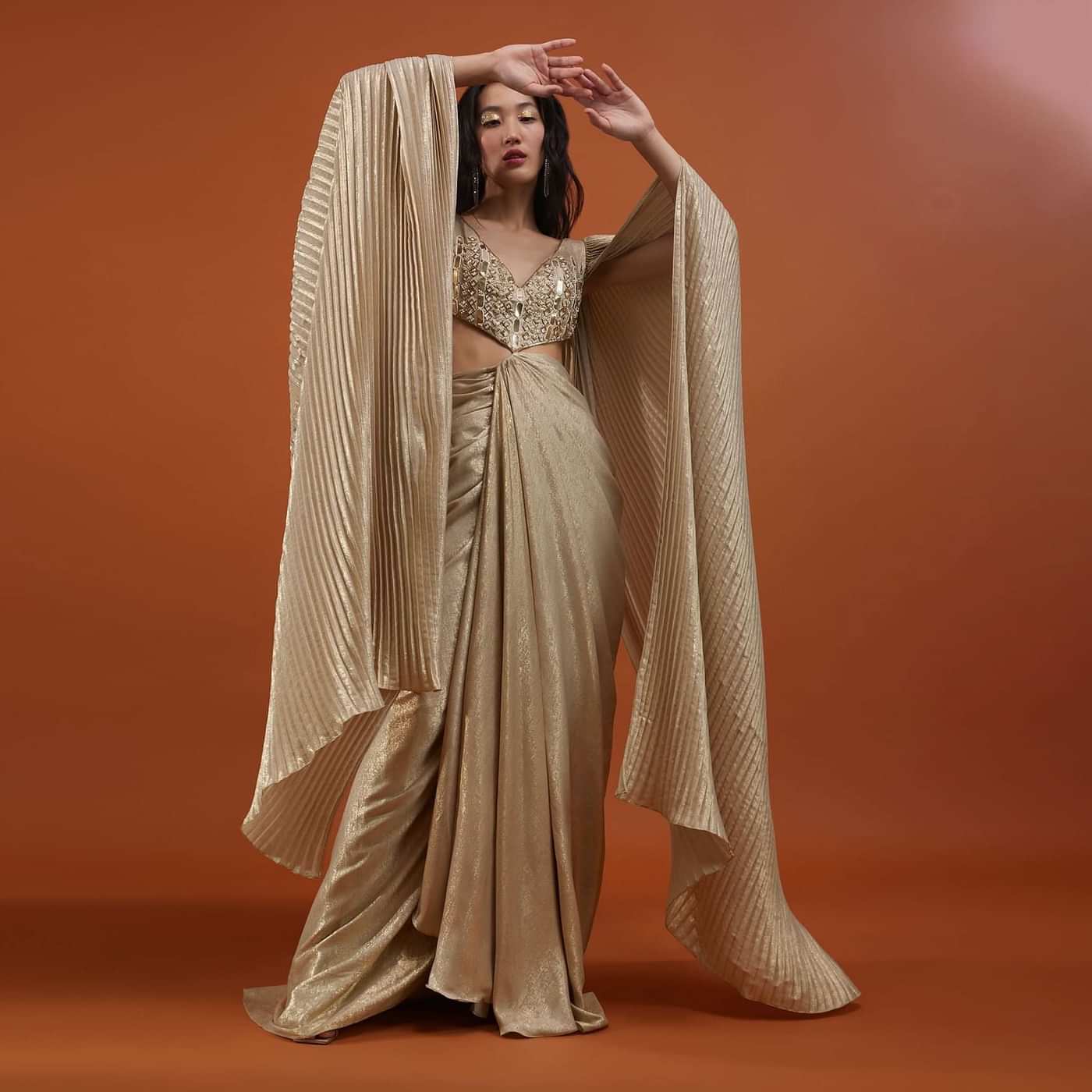 Mocha Brown Gown With A Pre-Pleated Dhoti Skirt And Royal Cape Sleeves - NOOR 2022