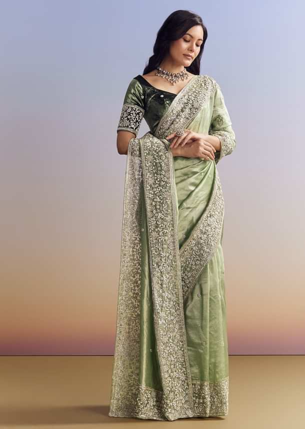 Green Tissue Saree With Velvet Blouse And Richly Embroidered Borders