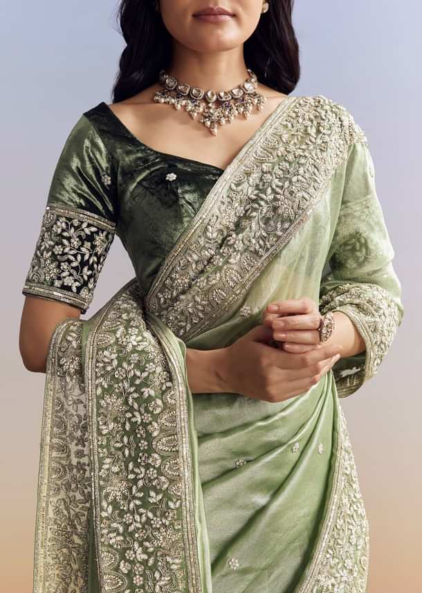 Green Tissue Saree With Velvet Blouse And Richly Embroidered Borders