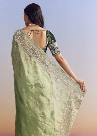 Green Tissue Saree With Velvet Blouse And Richly Embroidered Borders