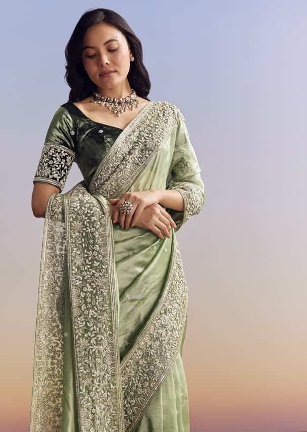 Green Tissue Saree With Velvet Blouse And Richly Embroidered Borders