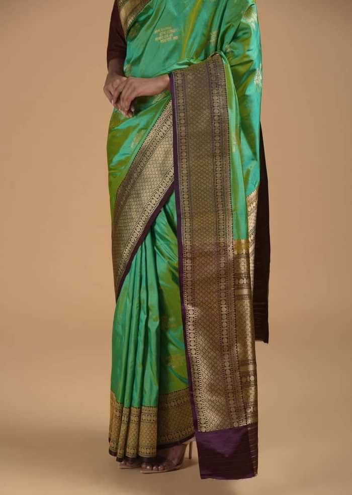 Green Two Toned Pure Handloom Saree In Silk With Woven Text Motifs And Purple Border