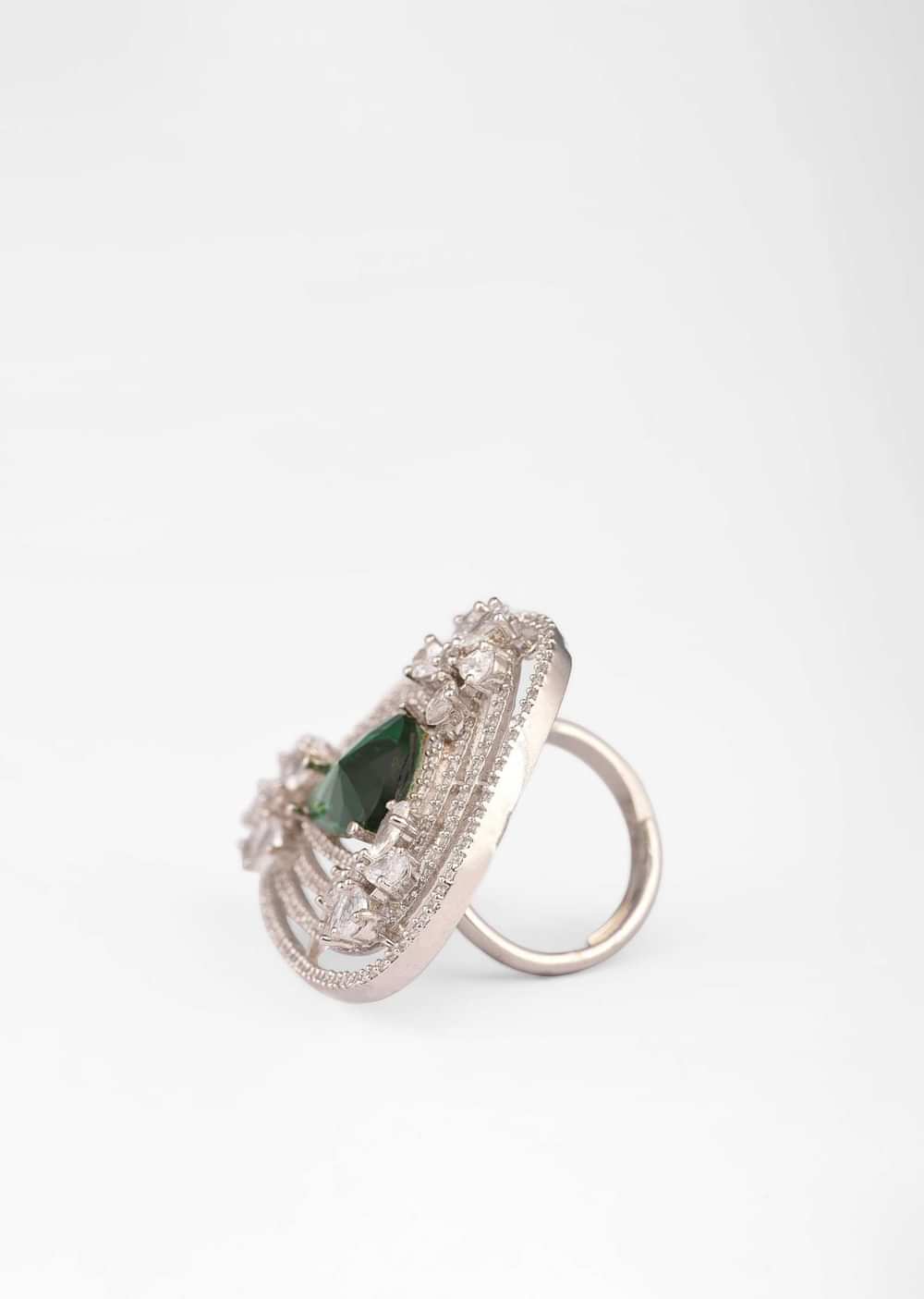 Green Stone Studded Ring With Swarovski Work In Triangle And Floral Design