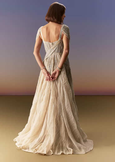 Grey Gown With Draped Cap Sleeves And Flowing Embroidered Flare