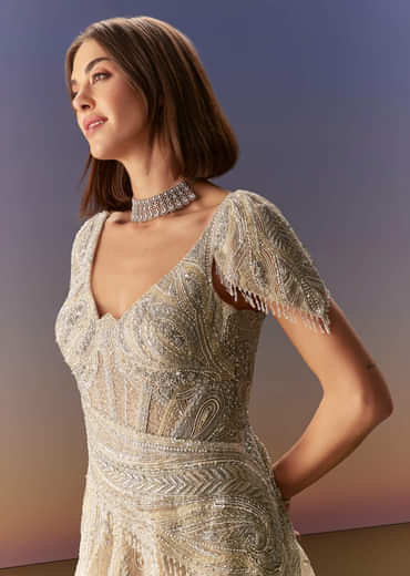 Grey Gown With Draped Cap Sleeves And Flowing Embroidered Flare