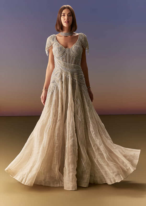 Grey Gown With Draped Cap Sleeves And Flowing Embroidered Flare