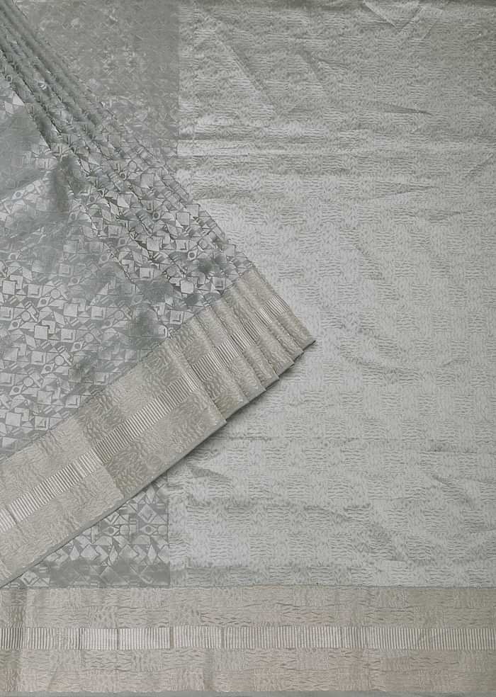 Grey South Silk Saree With Abstract Zari Border And Unstitched Blouse Fabric