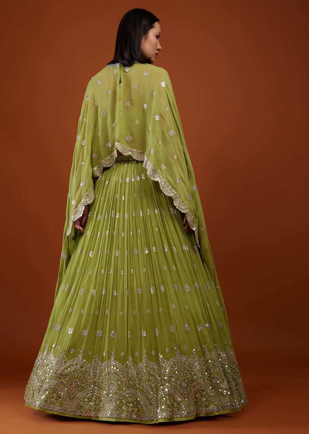 Pista Green Embroidered Lehenga In Georgette With Cape