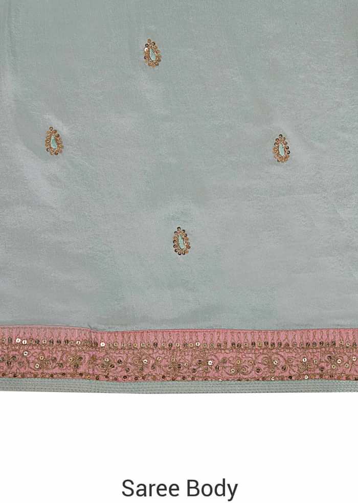 Ice blue saree in satin crepe in sequin butti and border only on Kalki