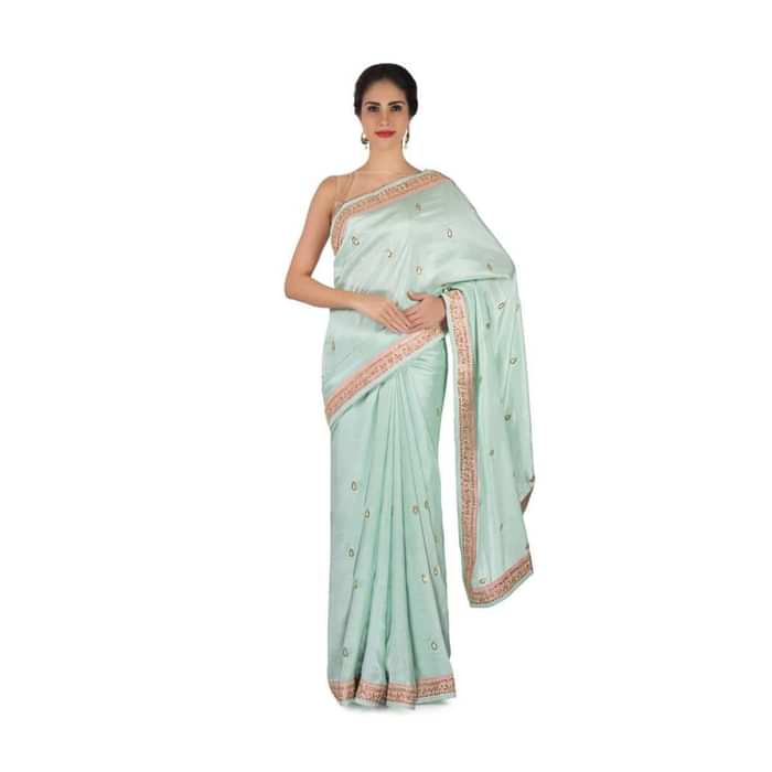 Ice blue saree in satin crepe in sequin butti and border only on Kalki