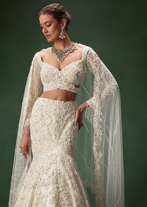 Ivory Mermaid Bridal Lehenga With Full Sleeves And Heavy Embroidery
