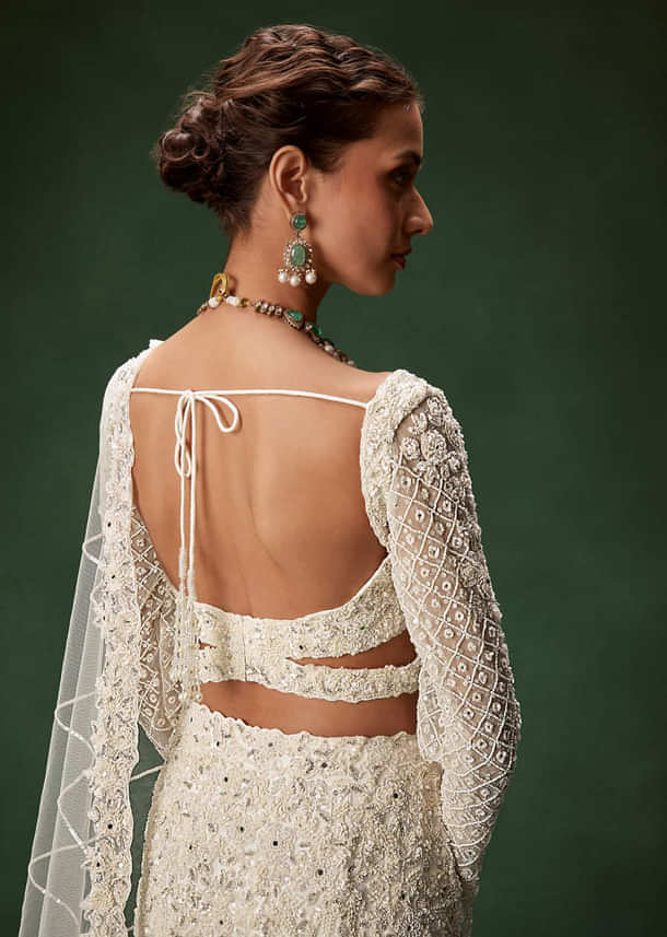 Ivory Mermaid Bridal Lehenga With Full Sleeves And Heavy Embroidery