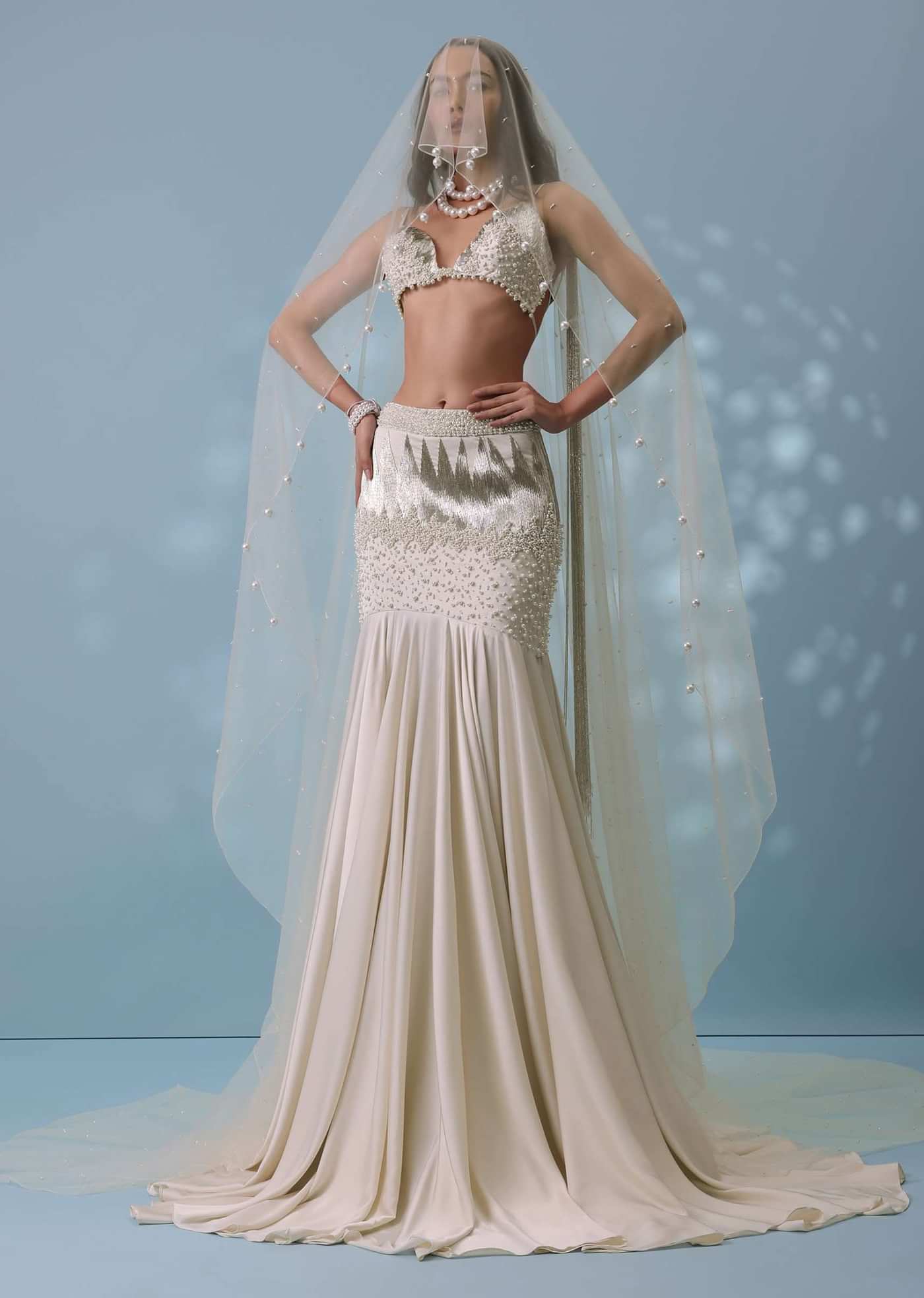 Ivory White Embroidered Trail Lehenga Set In Milano Satin With Tassel Blouse