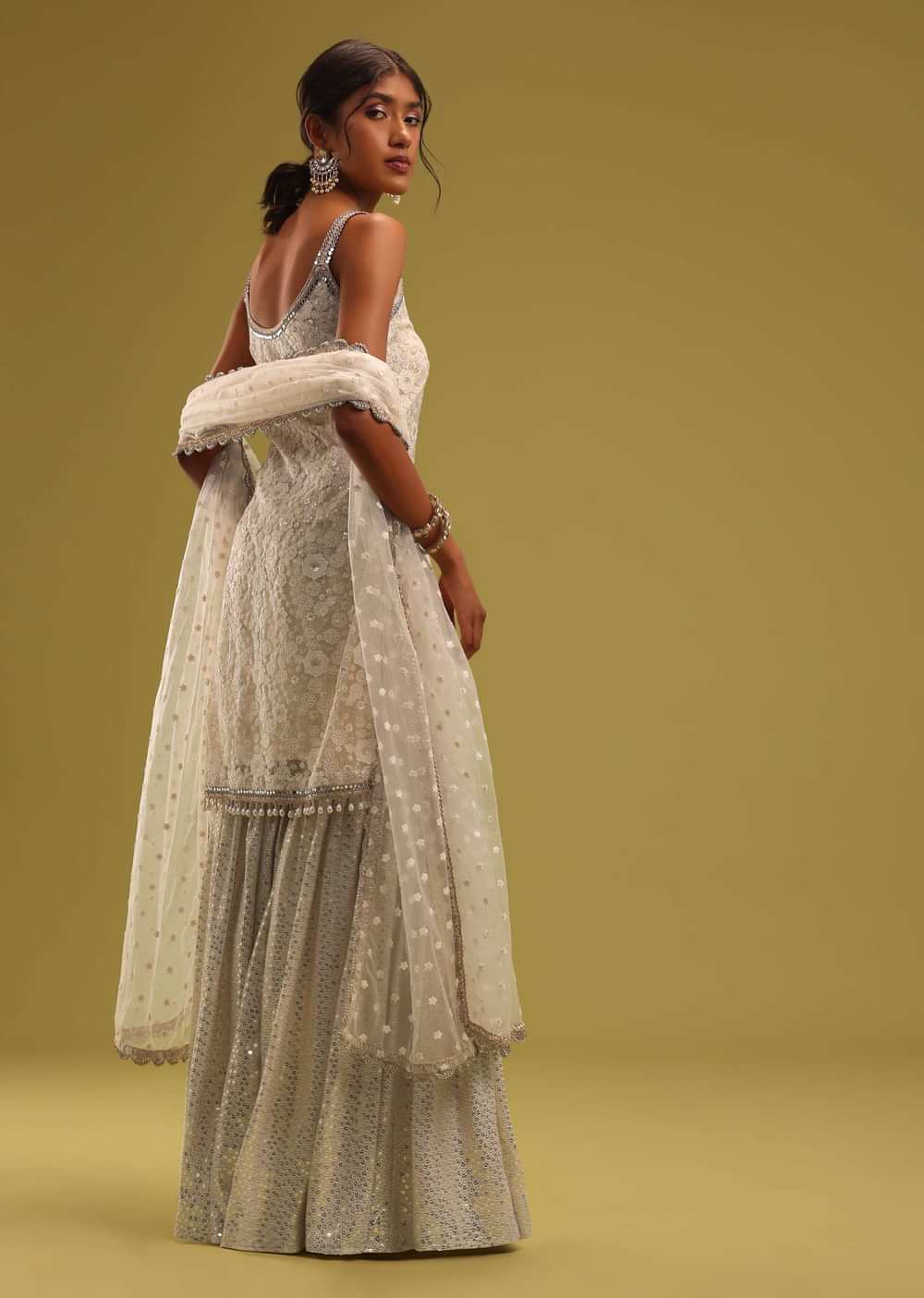 Ivory White Lucknowi Embroidered Net Kurti And Georgette Sharara Set