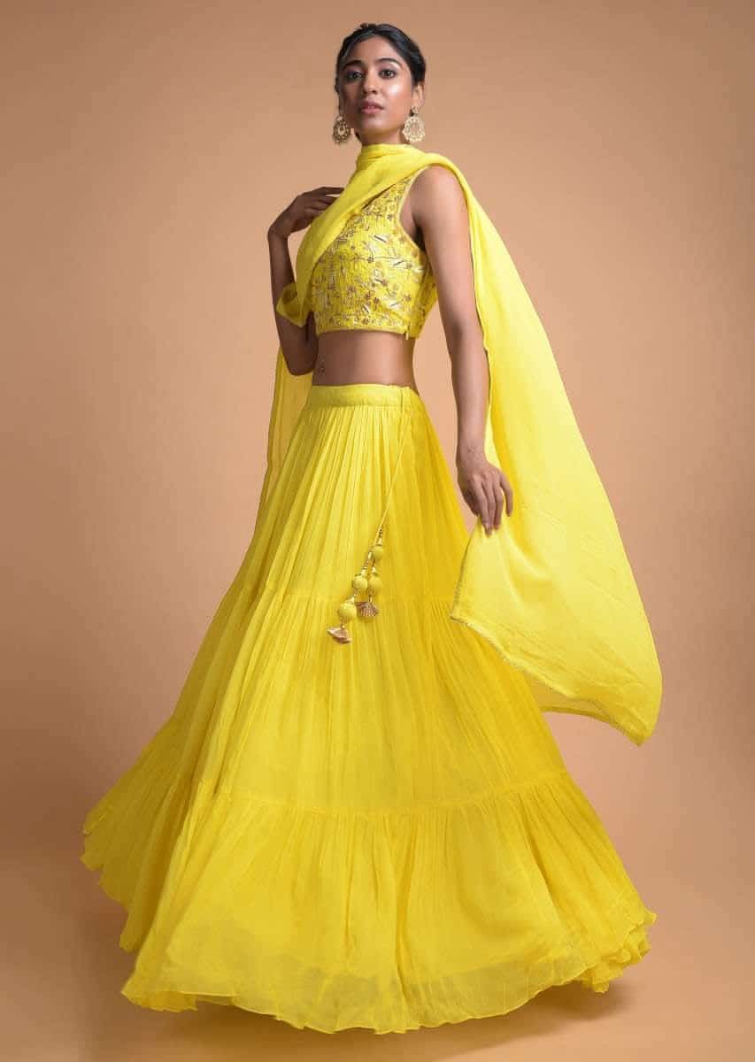 Lemon Yellow Lehenga In Tiered Pattern And Jaal Embroidered Sleeveless  Choli Online Kalki Fashion