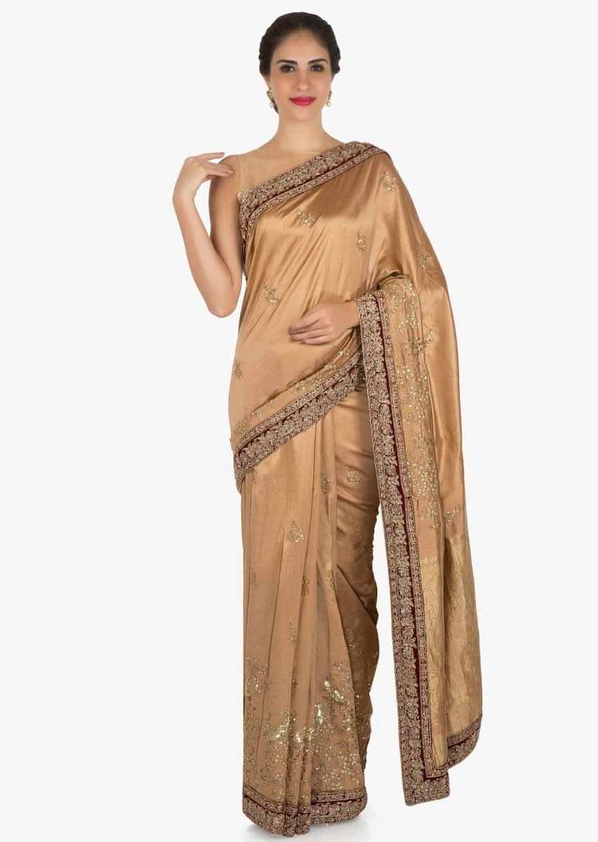 Light brown saree in cotton silk embellished in heavy sequin bird motif work only on Kalki