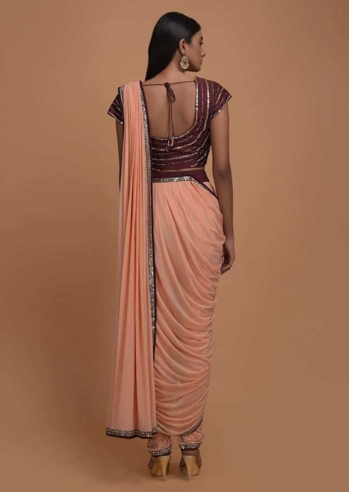 Melon Peach Ready Pleated Dhoti Saree With Maroon Mirror Embellished Blouse Online - Kalki Fashion