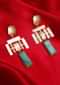 Metal Coated Fancy Party Wear Earring With Emerald Green Stone Online - Kalki Fashion