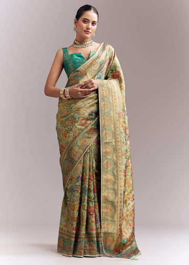 Mint Green Dola Silk Woven Saree With Embroidered Nature Motifs Mint Green Dola Silk Woven Saree With Embroidered Nature Motifs