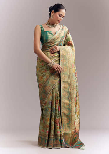 Mint Green Dola Silk Woven Saree With Embroidered Nature Motifs Mint Green Dola Silk Woven Saree With Embroidered Nature Motifs