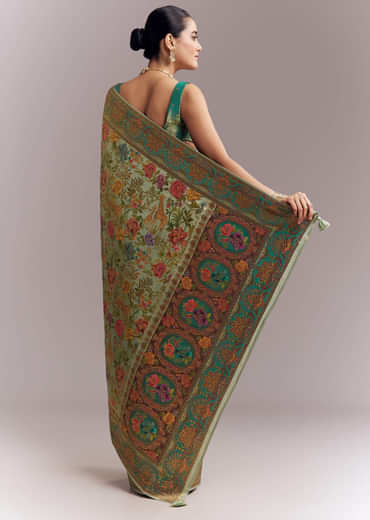 Mint Green Dola Silk Woven Saree With Embroidered Nature Motifs Mint Green Dola Silk Woven Saree With Embroidered Nature Motifs