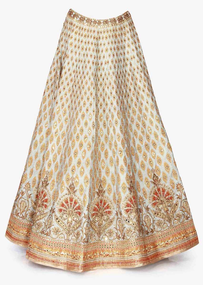 Mint blue lehenga in raw silk enhanced in zari patchwork embroidery only on Kalki