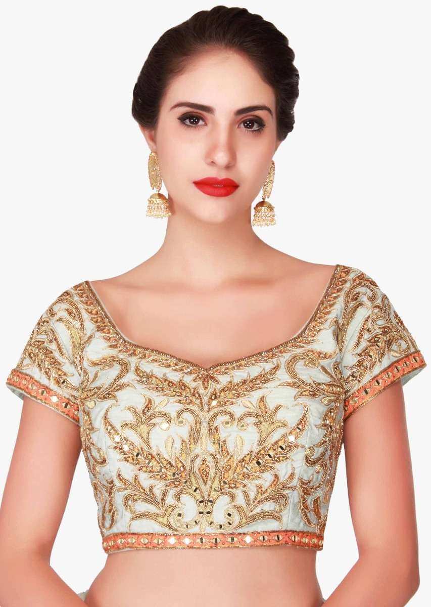 Mint blue lehenga in raw silk enhanced in zari patchwork embroidery only on Kalki