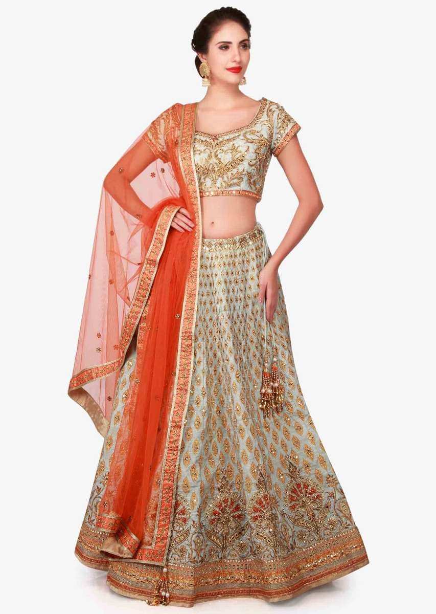Mint blue lehenga in raw silk enhanced in zari patchwork embroidery only on Kalki