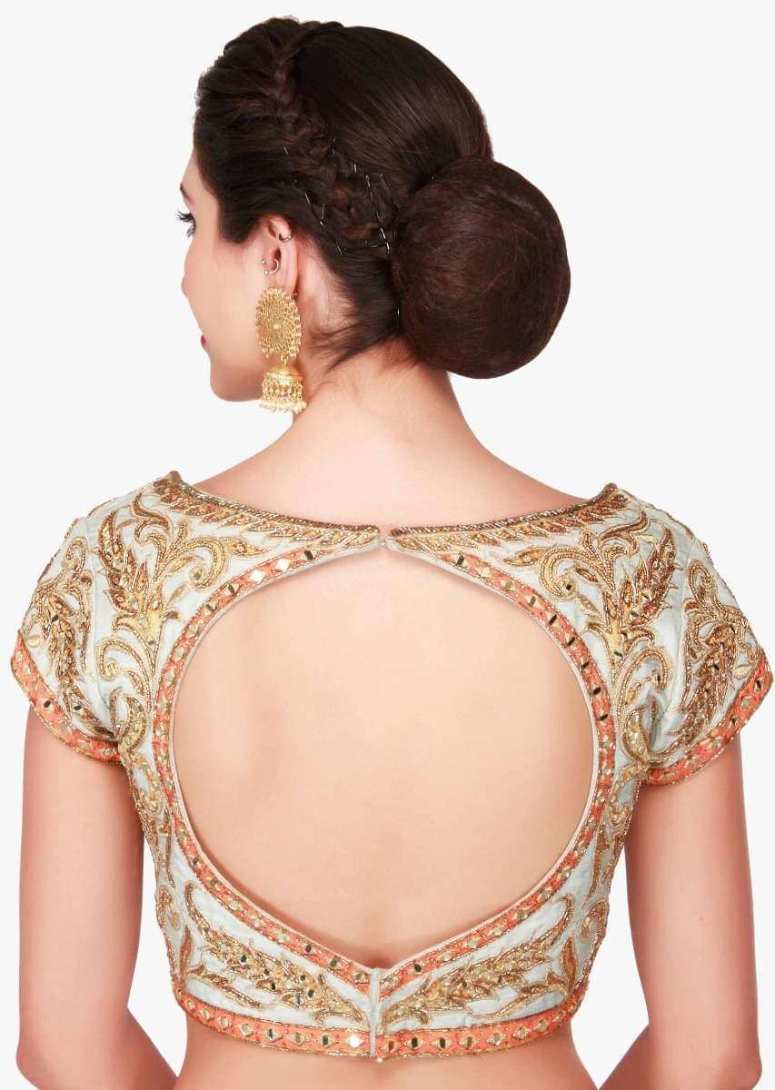 Mint blue lehenga in raw silk enhanced in zari patchwork embroidery only on Kalki